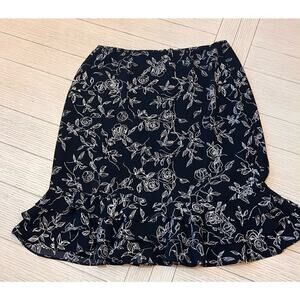 Floral print zip closure w/ elastic waist knee length skirt with ruffle trim. 12